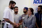 Karandeep Singh, who is seeking asylum from political persecution in India, speaks with an interpreter at a press conference Aug. 22, 2018.