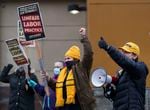 Members of UFCW Local 555 demonstrate outside of a Portland Fred Meyer store in 2021. The union is attempting to recall state Rep. Paul Holvey, D-Eugene.