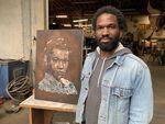 Jeremy Okai Davis with his work-in-progress portrait of civil rights activist Pauli Murray at his Portland, Ore., studio on June 8, 2020.