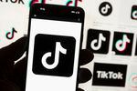 TikTok would be banned from most U.S. government devices under a government spending bill Congress unveiled early Tuesday, the latest push by American lawmakers against the Chinese-owned social media app.