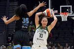 Seattle Storm guard Sue Bird (10) passes around the defense of Chicago Sky guard Rebekah Gardner (35) during the second half of a WNBA basketball game Wednesday, May 18, 2022, in Seattle.