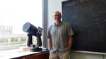 University of Oregon astronomy lecturer Dr. Scott Fisher is director of the Pine Mountain Observatory where many celestial events are observed and studied. He's pictured here in his office in Klamath Hall on the UO campus in Eugene.