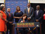 New York Gov. Kathy Hochul signs legislation on Monday banning anyone under age 21 from buying or possessing a semi-automatic rifle, among a series of other changes to the state's gun laws.