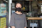 Tight Tacos co-owner Annamarie Cosio stands at the door to their space in The Zipper in Northeast Portland on April 16, 2020. The restaurant stayed open for takeout and delivery. 