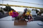 Flowers placed outside the Safeway in Bend, Ore., on Aug. 29, 2022, where a gunman opened fire and killed two people the day before.