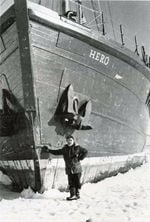 Hero Captain Pieter Lenie poses with the boat in particularly icy conditions in December 1977.
