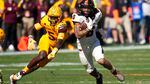 Oregon State running back Damien Martinez (6) runs past Arizona State defensive back Chris Edmonds (5) during the first half of an NCAA college football game in Tempe, Ariz., Saturday, Nov. 19, 2022.
