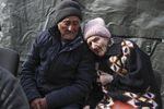 March 26: Boris Khijniak, 69, and his wife Galina, 75, are brought to a center near Irpin, the Ukrainian capital, as the evacuation of civilians from the Ukrainian Irpin continues.