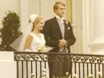 Tricia Nixon and Edward Cox stand together on the balcony of the South Portico of the White House.