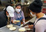 Staff make tortillas at Three Sisters Nixtamal in Portland, Ore., July 20, 2022.