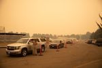 FILE: Evacuees of the Beachie Creek Fire gather at the Linn County fair grounds evacuation center in Albany, Ore., Sept. 8, 2020.
