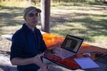 Guy Mansfield, with the Washington State Search And Rescue Planning Unit, uses high-tech mapping systems on a laptop at Fort Simcoe Historical State Park in search of hidden remains.