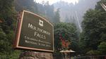 The Multnomah Falls sign on Sept. 6, 2017 as the Eagle Creek Fire looms nearby.