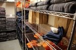 Socks, sandals, clothing and blankets line the shelves of a stock room at the Deschutes County Jail in Bend, Ore., Tuesday, March 12, 2019. In Oregon, jails must comply with a set of statewide standards that govern everything from riot control to a requirement that mattresses and blankets be fire-retardant.