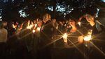 Community members gathered together Thursday evening at Stewart Park in Roseburg, Oregon, to mourn for those lost in a deadly shooting at Umpqua Community College earlier in the day.