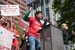 A Portland high school student who goes by the name Jolly Wrapper addresses a rally of teachers and their supporters in Portland, Ore., on May 8, 2019. The crowd gathered to advocate for more school funding.