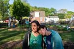 Jenna Fournel and Leal Abbatiello, 14, pose for a portrait at their home in Alexandria, Va. on April 30, 2022. Since the start of the pandemic in 2020, Fournel and her son expanded their garden and began harvesting and giving away produce for free to their community.