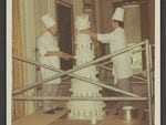 White House Pastry Chef Ferdinand Louvat and New York pastry chef Maurice Bont assemble Luci Baines Johnson's wedding cake on Aug. 6, 1966,
