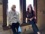 Ellen Simmons and Danielle Denham take a moment to listen to the sounds inside the empty Nelson House