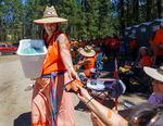 Crystal Conant hands out frozen salmon to attendees at last year’s First Salmon Ceremony. Conant said because the salmon no longer swim at Kettle Falls, “There’s bits and pieces of all of our hearts that are missing.” 