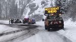 Emergency crews respond to a crash on Oregon's snowy Santiam Pass at milepost 77 in on Tuesday, Nov. 26, 2019.