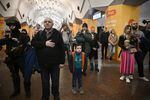 March 26: Residents of a metro station used as a bomb shelter listen to musicians play for them in Kharkiv.