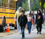 Students at Sitton Elementary School in Portland walk from the bus to the front entrance of school for their first day in the 2023-24 academic year on Aug. 29, 2023.