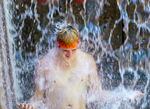 Johnny Daniels of Portland cools off in the Ira Keller Fountain Park, June 28, 2021. 