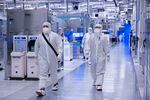 A photo from November 2021 shows employees in cleanroom "bunny suits" working at Intel's D1X factory in Hillsboro, Ore. The company's presence in the state has helped Oregon become one of the world's leading hubs of semiconductor manufacturing and research.