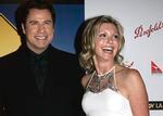 FILE - John Travolta, left, and Olivia Newton-John arrive at the The Penfolds Icon Gala Dinner in Los Angeles on Jan. 14, 2006. Travolta, who starred with Newton-John in "Grease," presented Newton-John with the "Lifetime Achievement award. Newton-John, a longtime resident of Australia whose sales topped 100 million albums, died Monday at her southern California ranch, John Easterling, her husband, wrote on Instagram and Facebook. She was 73.