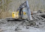 An excavator working in the debris field near Oso, Wash., where a mudslide destroyed a neighborhood in March. The death toll reached 28 as of April 2.