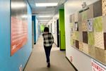 A student walks down the hallway at Rosemary Anderson High School’s east campus. The alternative high school program is small and serves students who are referred by their home school.