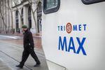 The TriMet Max picks up passengers in downtown Portland.