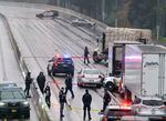 Portland police block off a portion of I-5 after an alleged carjacking and shooting Monday, Dec. 6, 2021.