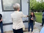 Gov. Tina Kotek fist bumps Oregon Rural Action organizer Ana Maria Rodriguez while visitng her home in Boardman on May 3 to learn more about nitrate contamination and how its impacting residents.