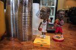 Basketball figures deck the counter at sneaker-themed Deadstock Coffee in Chinatown, Portland.  