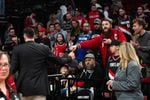 Trail Blazers center Jusuf Nurkić (left) fist bumps a fan after Portland fell to the Sacramento Kings on March 9, 2020. The NBA has advised against handshakes and autographs amid the coronavirus outbreak, and has reportedly told teams to prepare to play in empty stadiums.
