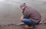 USFWS biologist Evan Childress releases a sucker into Upper Klamath Lake.