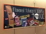 A sign at Multnomah County warns people about the dangers of flavored tobacco.