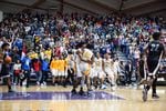 Jefferson High School fans celebrate following a big basket during OSAA boys basketball championships in Portland, Ore., March 10, 2018.