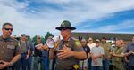 In this screenshot from a YouTube video, Lewis County Sheriff Robert Snaza tells a crowd "Don't be a sheep" when it comes to following Gov. Jay Inslee's face covering order.