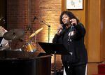 Marilyn Keller, a leading force behind Measure 114, sings at the election watch party held at Augustana Lutheran Church in Portland, Ore., Nov. 8, 2022.