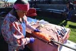 Roma David prepares salmon for the last weekend of operation at Kah-Nee-Ta resort.