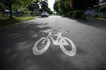 An Oregon street with a bicycle lane painted on it. 