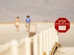 A sign warns of extreme heat danger last June at the Badwater Basin in Death Valley, Calif.
