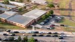 Authorities say the gunman entered Robb Elementary School through a rear door near a parking lot — and they have clarified that a teacher did not leave the door propped open. The school is seen here in an aerial view from May 25, the day after the shooting.