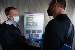 Larry Covey, left, of the Washington Department of Social and Health Services, discusses a proposed psychiatric campus in Vancouver with potential neighbor Tyler Castle on Nov. 4, 2021. The 48-bed campus has been proposed to decentralize psychiatric care from the state hospitals.