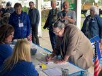 Gubernatorial candidate Betsy Johnson signs a petition to put her name on the November ballot on June 14, 2022. Johnson says she has now submitted enough signatures to qualify.