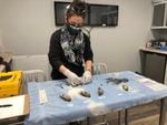 Veterinarian Dr. Laura Acevedo performs autopsies on salmonella-infected birds at the ThinkWild animal hospital in Bend, Ore., Feb. 1, 2021.