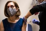 Governor Kate Brown receives a booster shot of the Moderna Covid-19 vaccine at Salem Health Edgewater Clinic in Salem, Ore. on Tuesday, Oct. 26, 2021.